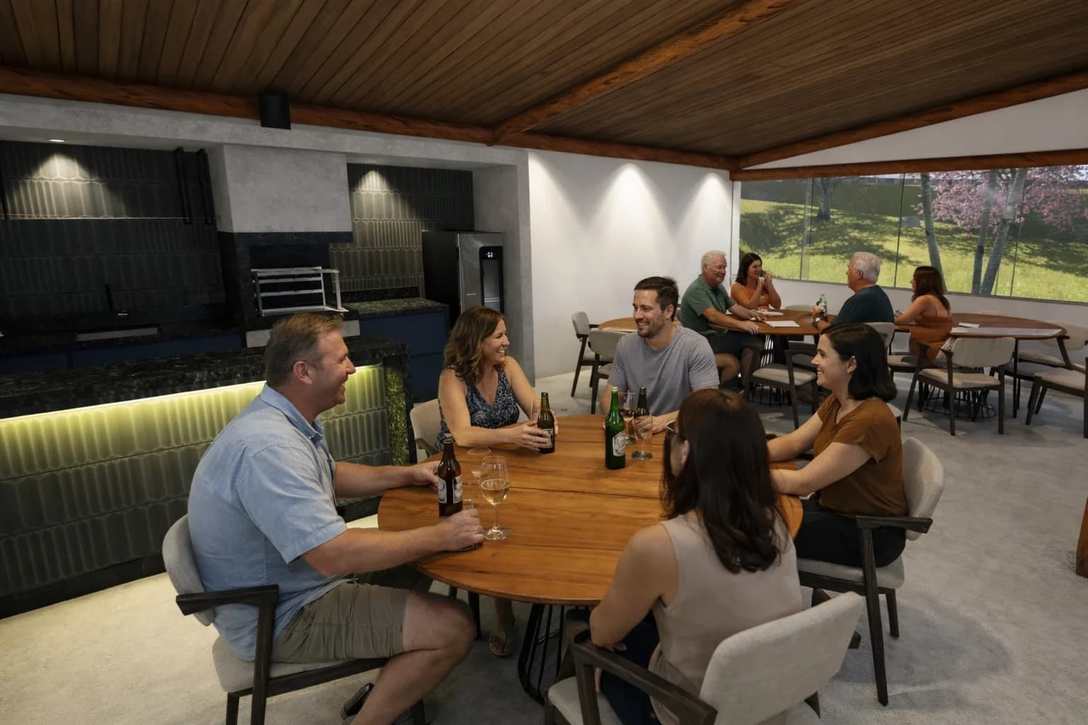 Área gourmet interna do clube com amigos reunidos à mesa (imagem ilustrativa)